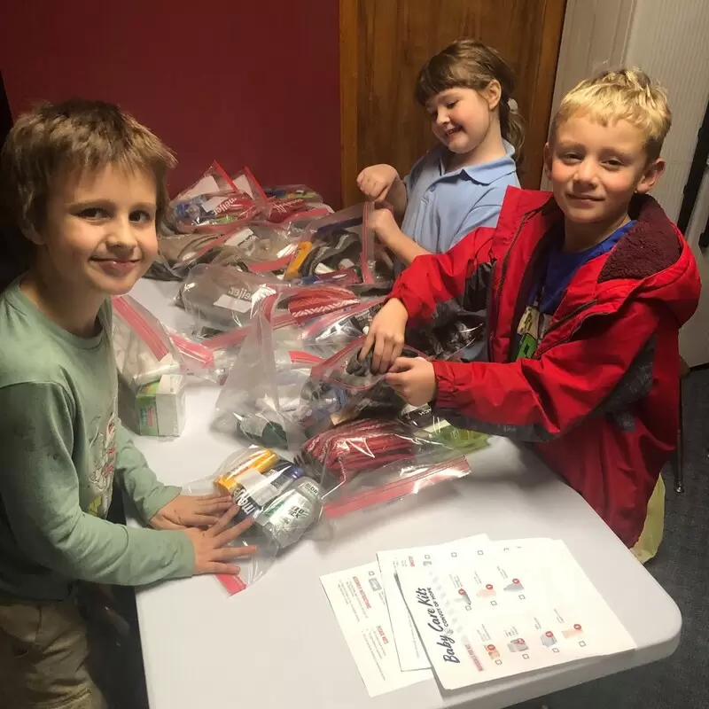 Ranger Kids wrapping personal hygiene items collected for Convoy of Hope