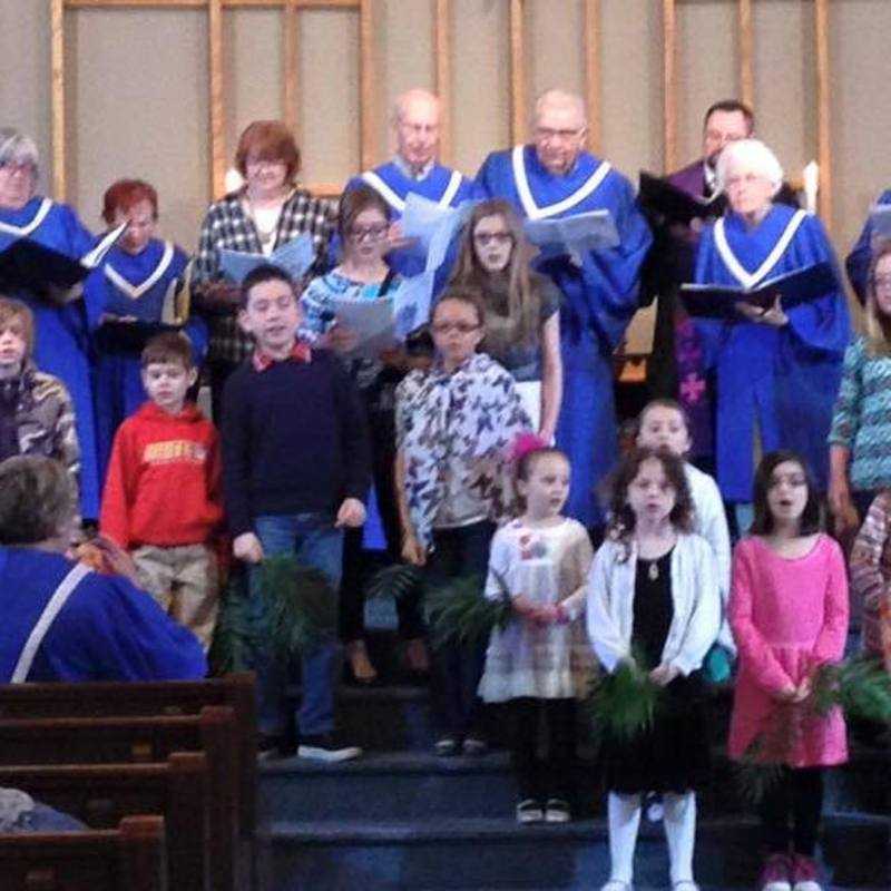 Kids and adult choir singing a Palm Sunday anthem