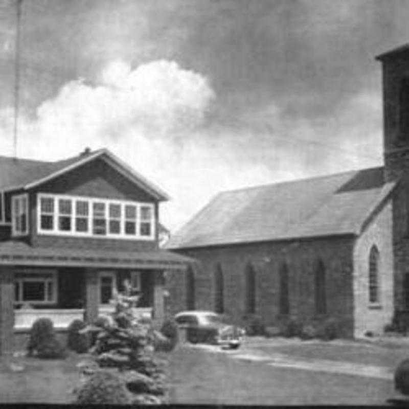 An older photo of St. Philomenas. Note steeple and windows. Photo presented by Gerry Ross