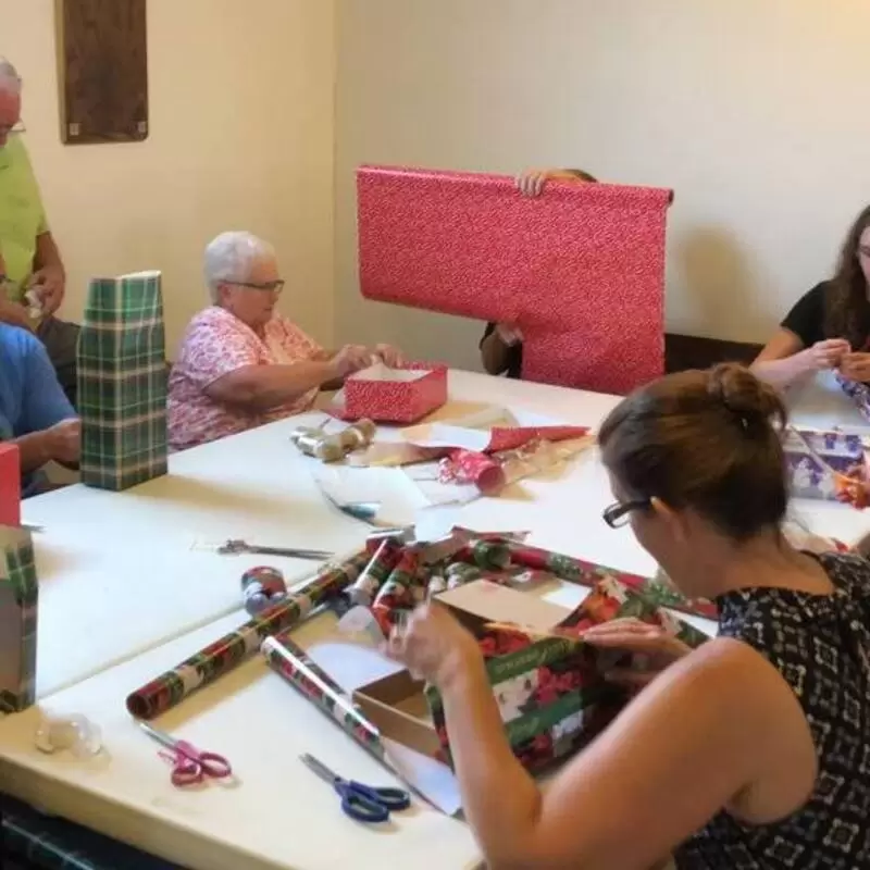 Christmas in August! Wrapping gifts for Peru.