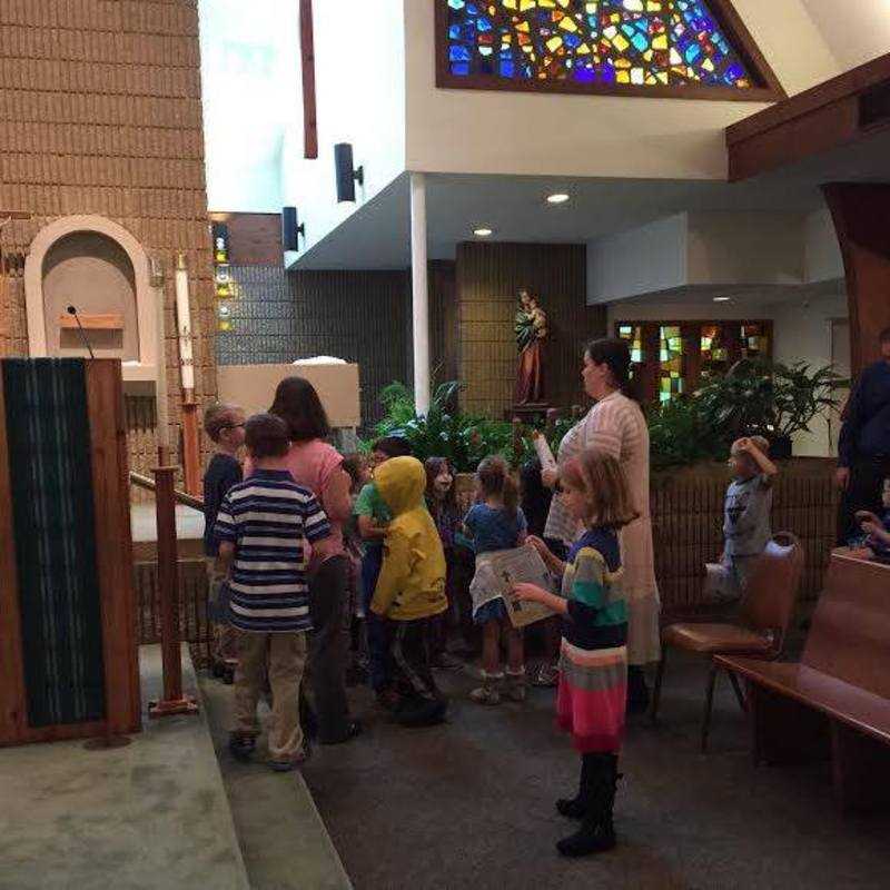 First graders checking out the Baptismal font