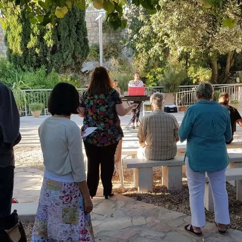 Clebrating church service in the Garden Tomb in Jerusalem