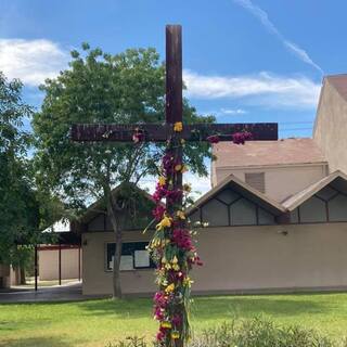 The cross with its Easter flowers