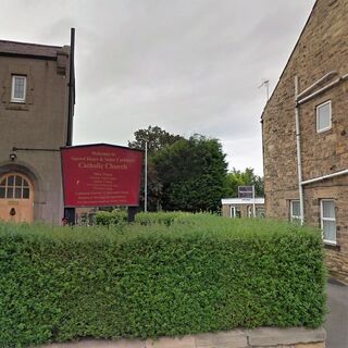 The Sacred Heart and St. Cuthbert church sign (High Street and Hallbank Lane)