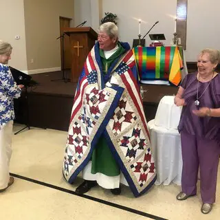 Pastor Jerry receiving his Quilt of Valor