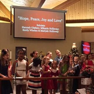 The children singing for our annual Hanging of the greens