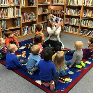 Reading fun Easter stories in library - First Presbyterian Preschool