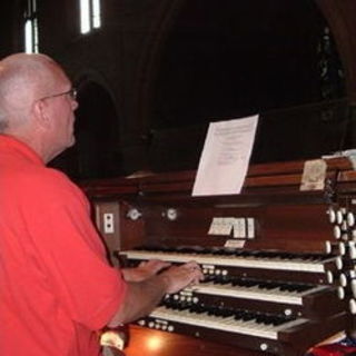 Our choirmaster and organist, Stephen Powell plays the organ