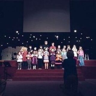 Pastor Gary and Amanda playing bells with the kids from NLKids