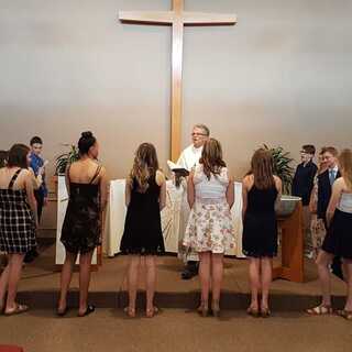 14 Confirmands affirm their Baptism