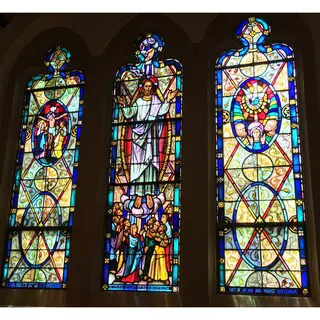 The Crucifixion, Ascension and Pentecost windows in the organ loft