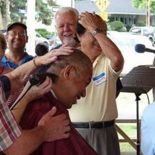 Parish Family BBQ - Fr. Vic gets his head shaved.