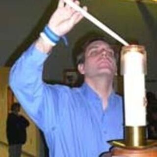 Lighting the baptismal candle from the Easter candle