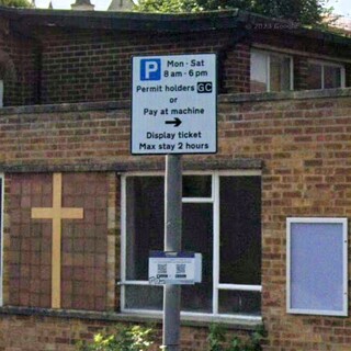 Paid parking sign at  St Mary's