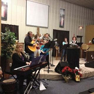 Worship team preparing for candlelight Christmas services