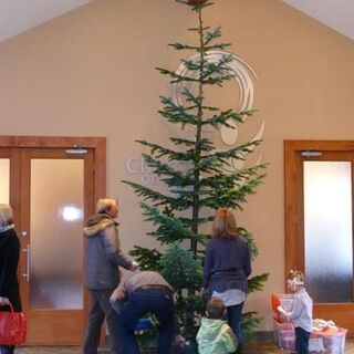 The Christmas Tree goes up at Church on 99