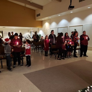 The Door Christian Fellowship Church Christmas candle lighting 2018 - photo courtesy of Rebecca Rodriguez