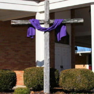 Cross draped with purple cloth