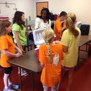 Wake Chapel youth packing food for Meals on Wheels