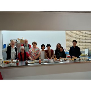 Servery full of helpers for community lunch