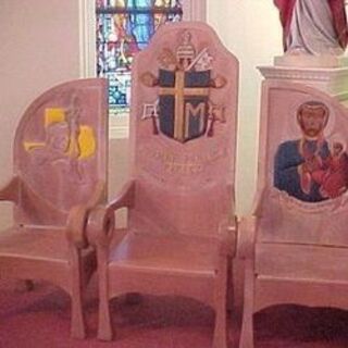 Three hand-carved chairs that were a gift from Pope John Paul II