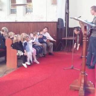 Singing 'God our Father' in the 10am Sunday Service