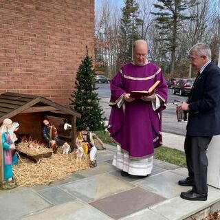 Monsignor Thomas Ginty blesses our Crèche