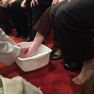 The Reverend Michael Wimmer washing the feet of his parish