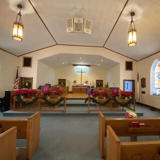 The sanctuary decorated for Advent and Christmas