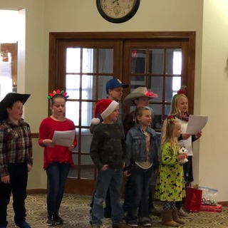 Foraker youth caroling at local assisted living centers