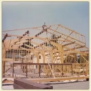 Early photo of gym building under construction for Community Bible Church Academy of Cave Junction, Oregon