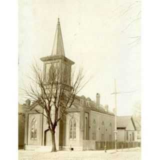 The first building at the corner of Eighth and Henry Streets in Alton